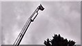 View of the bucket being raised at its highest in Barking Fire Station