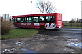 White dragon on a red bus in Johnston