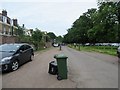 Wheelie bin in Campbell Road, KT8 9BS