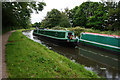 Canal boat Little Owl passes Movin On