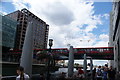 View of a DLR train crossing the bridge over Middle Dock from Canary Wharf