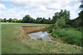 View of the River Roding meandering around a bend in Roding Valley Nature Reserve