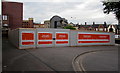 ST3088 : Orange notices on a fenced-off area outside Newport railway station by Jaggery
