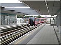 Docklands Light Railway train leaving Pudding Mill Lane station