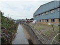 River Lowman passing industrial buildings