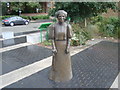 View of a maid statue on Bermondsey Wall E next to The Angel pub