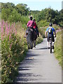 Cyclist passing riders