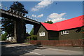 Well cared for tin building next to the viaduct in Crianlarich