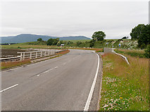 NH6869 : B817 Road Bridge over Rosskeen Burn by David Dixon