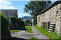 Back lane in Hope with distant view of Mam Tor