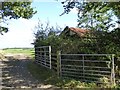 Two gates and a farm building near Highwood Farm