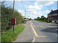 NY2247 : Elizabeth II postbox and phonebox on the A596, Waverton by JThomas