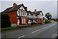 SO0392 : Row of four black and white houses, Caersws by Jaggery