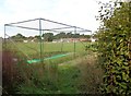 Cricket pavilion viewed through the nets 