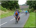 Cyclists climbing up from Waren Mill 