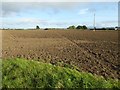 SP0044 : Footpath and ploughed field by Philip Halling