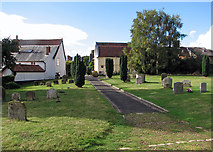 TM4249 : In Orford churchyard by John Sutton