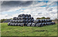 SO9828 : Silage bales by the bridleway  by David P Howard