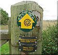 Footpath signs on gatepost