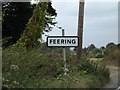TL8719 : Feering Village Name sign by Geographer