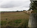 NT8953 : View of Hay Bales at Sunwick Triangulation Pillar by Peter Wood