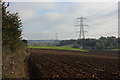 Ploughed field and power lines