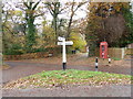 Telephone and mail boxes at junction of lanes