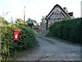 SJ4332 : Postbox at Colemere by Christine Johnstone