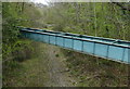 Pipebridge across a former railway trackbed