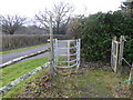 Footpath leaves field by kissing gate