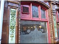 Tiles and window on the facade of The Imperial inn, Gloucester