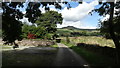 Country lane by Gorsty Low near Milton Chapel with view towards South Head