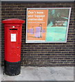 King George V pillarbox and railway posters outside Southampton Central railway station