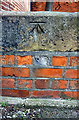 Benchmark on wall of Wilson Street at Slaughter House Lane junction