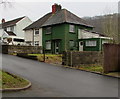 Dark green house in Llanfach, Abercarn