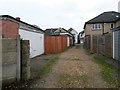 SZ1392 : West Southbourne: garages accessed from Irving Lane by Chris Downer