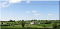 New built house set amidst undulating farmland in Tamlaght TD