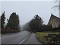 The B269 passing St James, Titsey