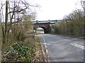 Railway bridge over Rocky Lane with train