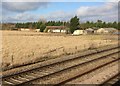 View from a Peterborough-London train - Buildings at Holmegreen Crossing