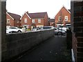 Wallisdown: footpath N01 comes out opposite some newish houses