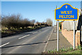 Sign beside road entering West Pelton