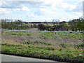 Plastic sheeting barrier along ditch