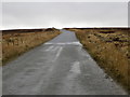 NY9346 : Moorland Road crossing Hunstanworth Moor near White Hill by Peter Wood