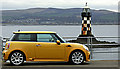 Yellow car and lighthouse