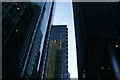 View of a building on Ropemaker Street reflected in The Heron