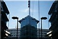 View of a building on Ropemaker Street reflected in a building on Finsbury Street