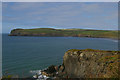 SN0439 : Cliffs at Carreg Germain and view across Newport Bay by Christopher Hilton