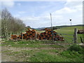 Felled trees and a small wind turbine