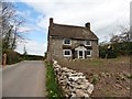 Thatched cottage at Road End Cross